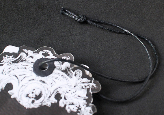 Pre-cut, pre-tied waxed cotton strings for hang tags