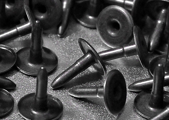 Hollow brass tacks for rivets